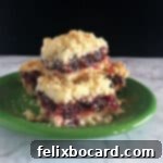stack of cranberry sauce bars on a small green plate