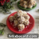 a stack of coconut date balls on a small red plate