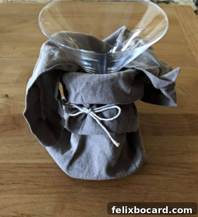 glass wrapped with a napkin tied with string