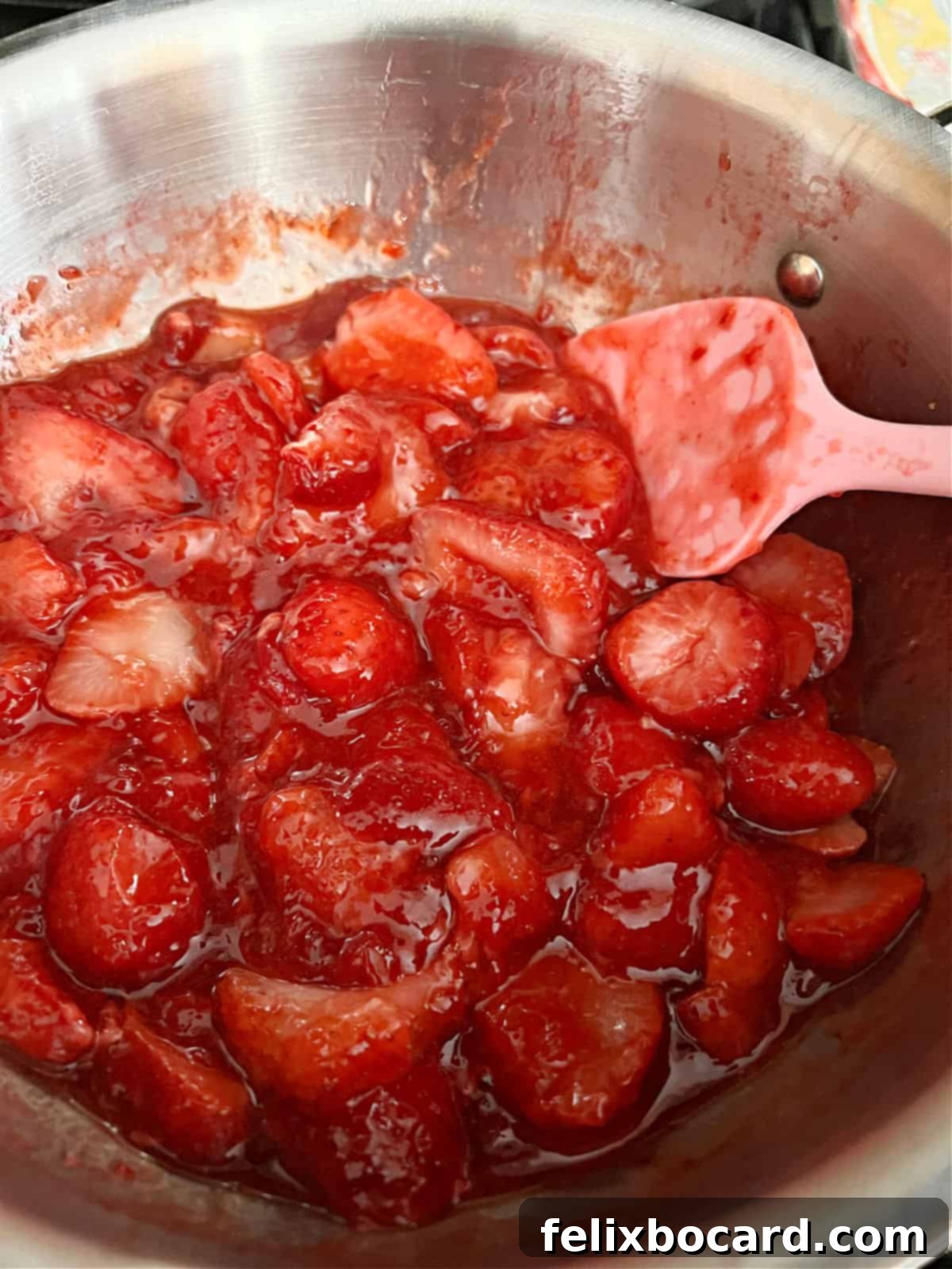 Simple Frozen Berry Sauce 4 Frozen berries and jam gently cooking in a small saucepan, transforming into a delicious berry sauce.