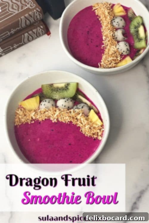 An overhead shot of a dragon fruit smoothie bowl, adorned with kiwi slices, blueberries, and toasted coconut, perfect for a Pinterest pin.