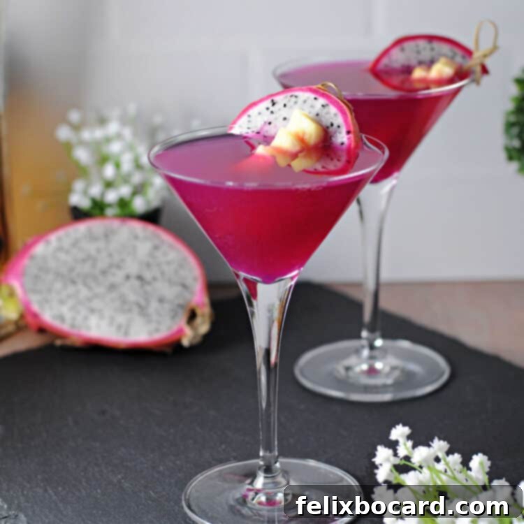 Dragon fruit cocktail in a martini glass, showcasing its vibrant magenta color and elegant presentation.