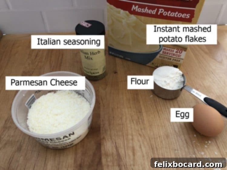 A selection of fresh ingredients including raw cod fillets, a bowl of instant potato flakes, grated Parmesan cheese, olive oil, flour, and Italian seasoning.