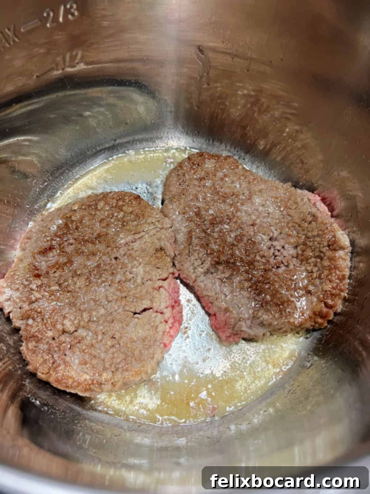Coated meat browning in the Instant Pot.