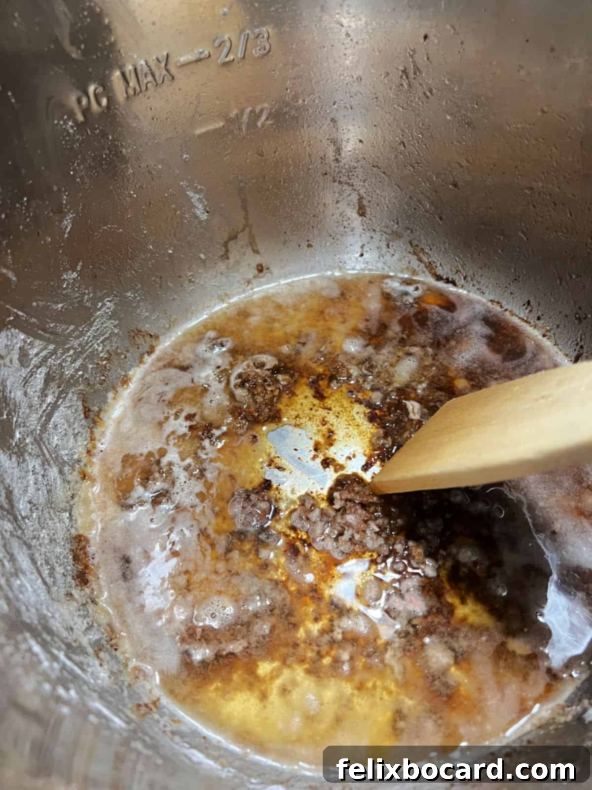 Deglazing the pot with a splash of broth.