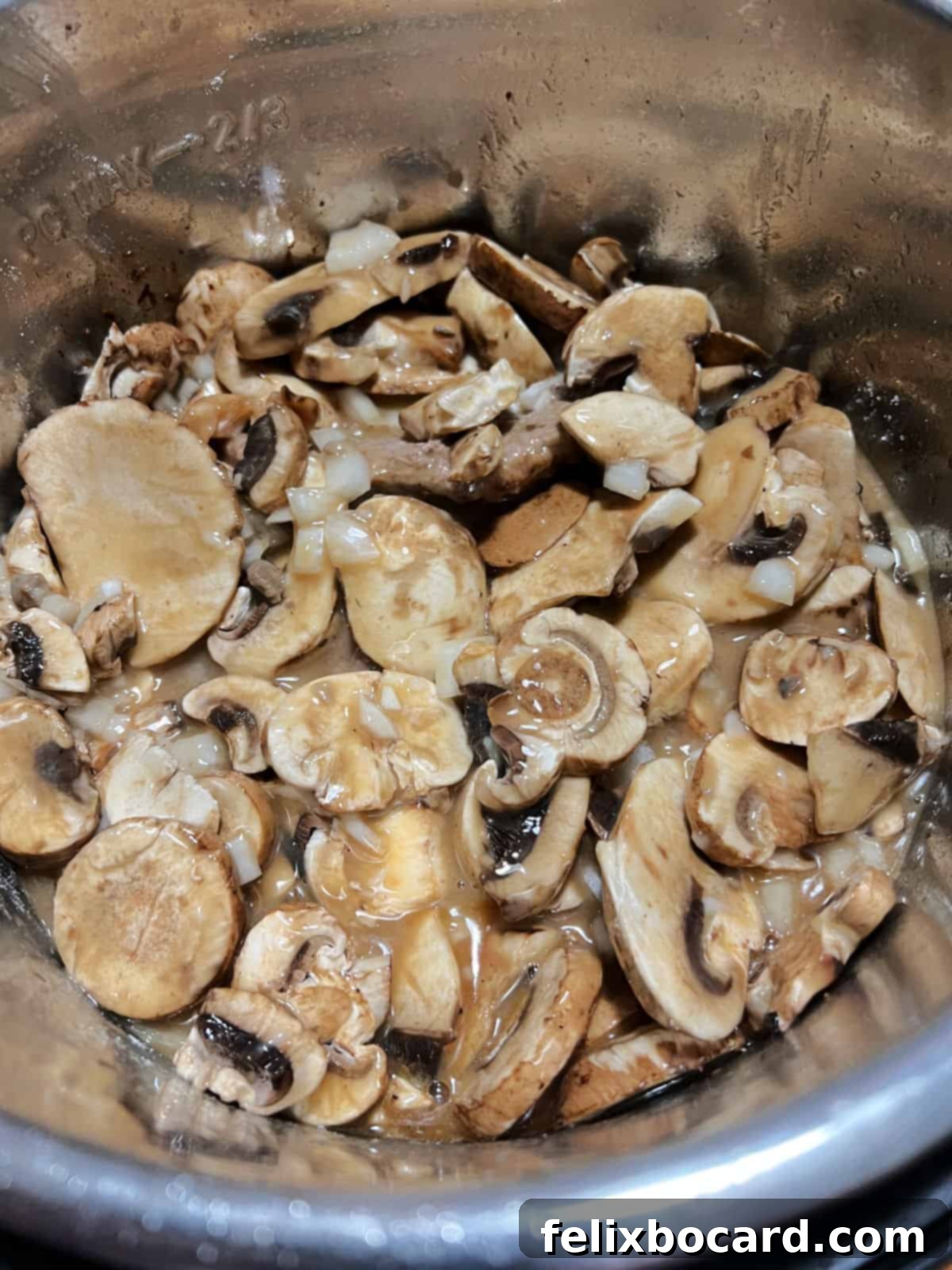 Mushroom and soups mixture added to the pot.