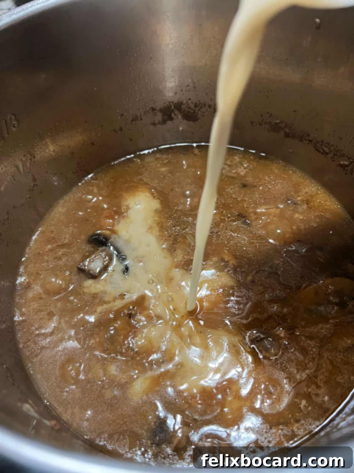 Adding a thickening flour slurry to the hot liquid.