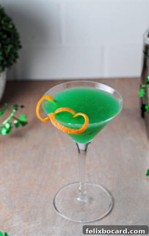 An overhead view of a vibrant green Shamrock Martini, perfectly showcasing its inviting color and elegant presentation.