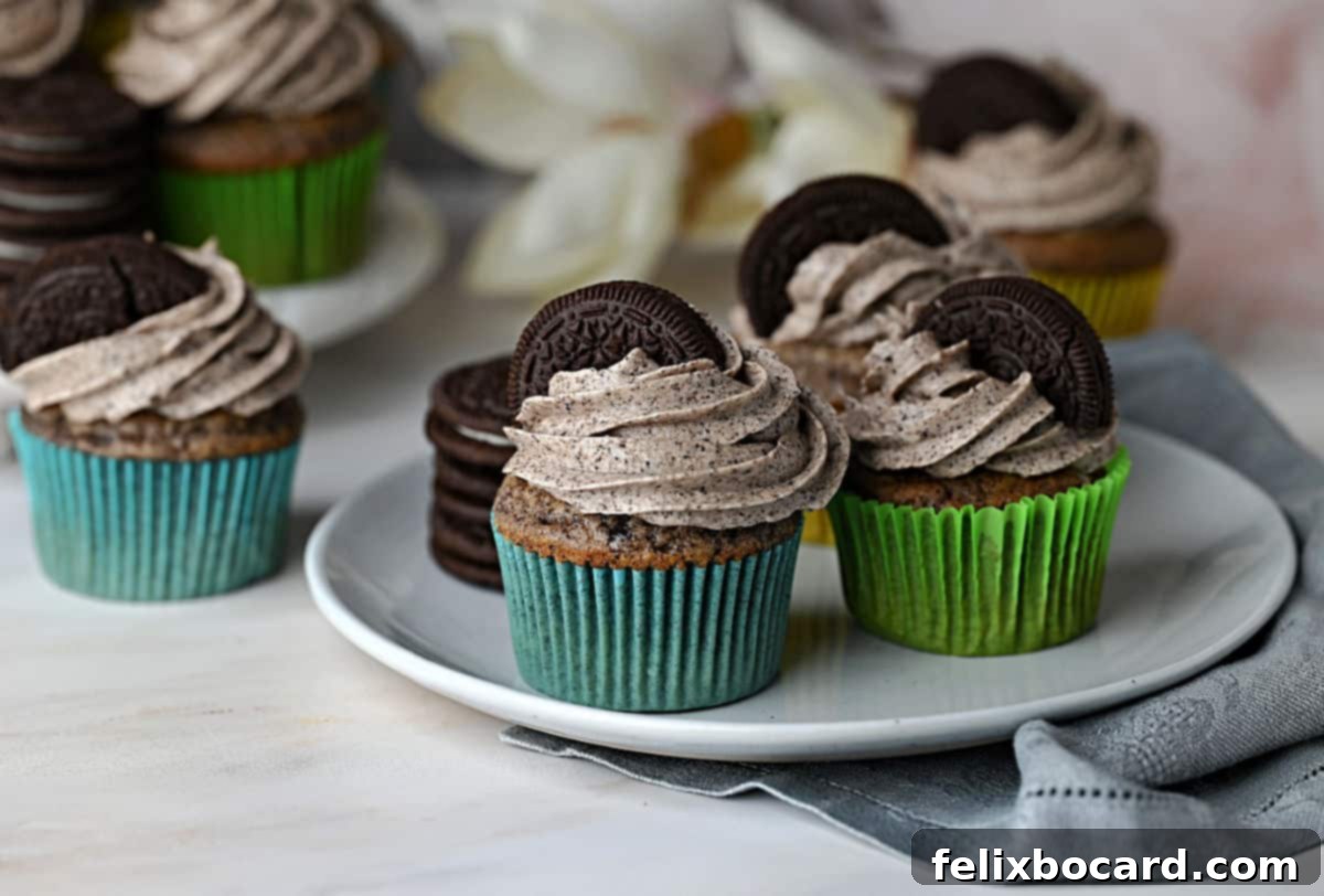 Delicious Oreo cupcakes on a decorative plate, ready to be enjoyed.
