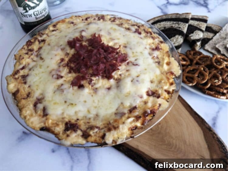Warm and cheesy Reuben dip ready to be served, garnished beautifully