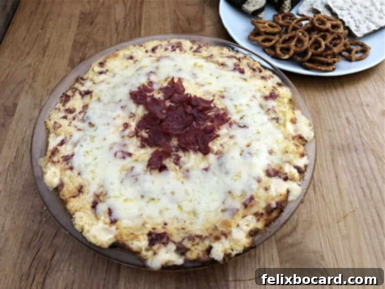 Reuben dip served with pretzels, ready for dipping