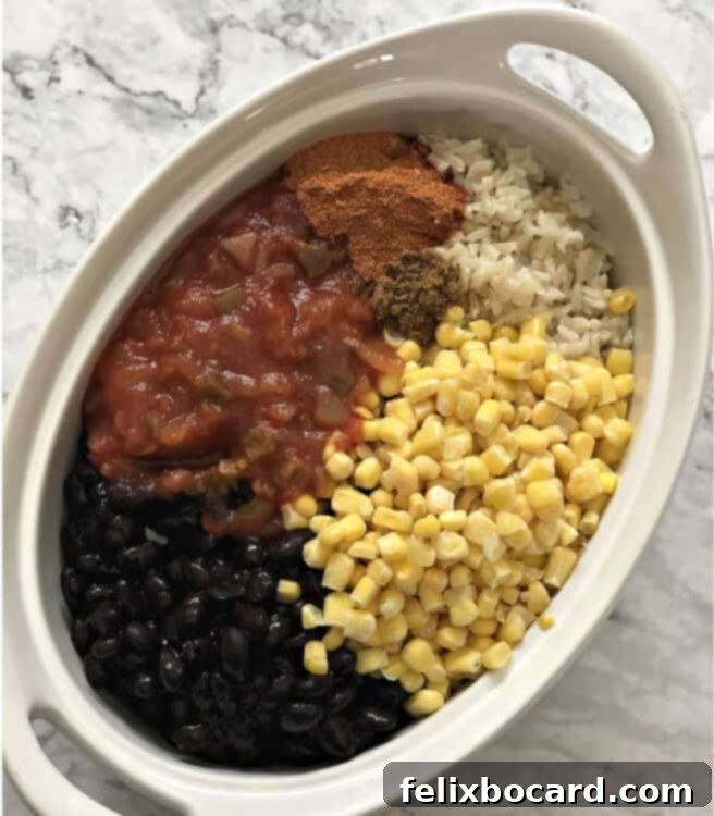 Ingredients in an oval casserole dish before baking