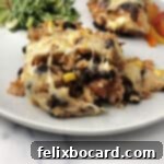 Brown rice and black bean bake on a white plate with a fork