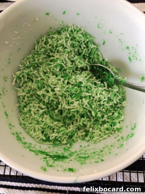 mixing coconut with food coloring in a bowl