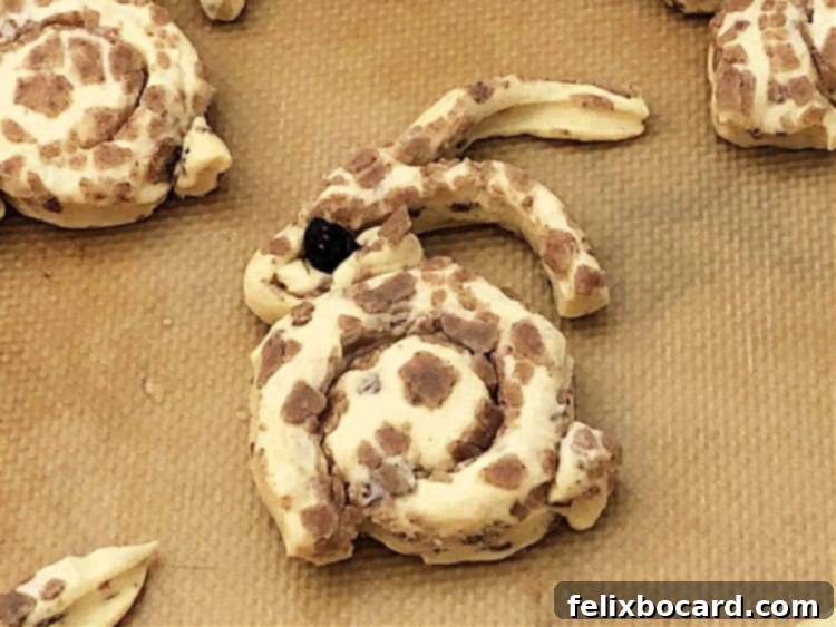 unbaked cinnamon roll shaped into a bunny