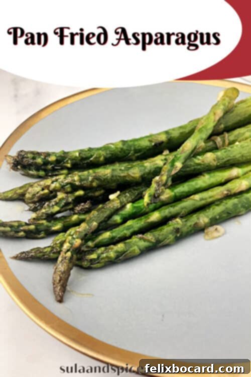 A vibrant close-up of beautifully pan-fried asparagus spears served on a plate, ready to be enjoyed.