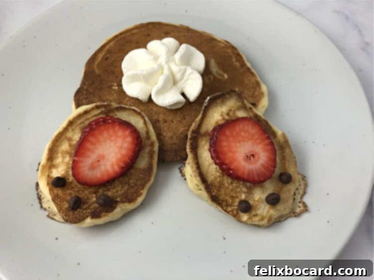 Close-up of a delightful bunny butt pancake display, featuring perfectly cooked pancakes, artfully sliced strawberries, and a dollop of fluffy whipped cream arranged to resemble a charming bunny's derriere, complete with tiny chocolate chip toe pads.
