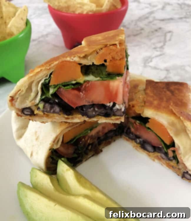 cut crunch wrap showing the veggie layers inside