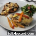 Fajita stuffed chicken on a plate with rice and a salad