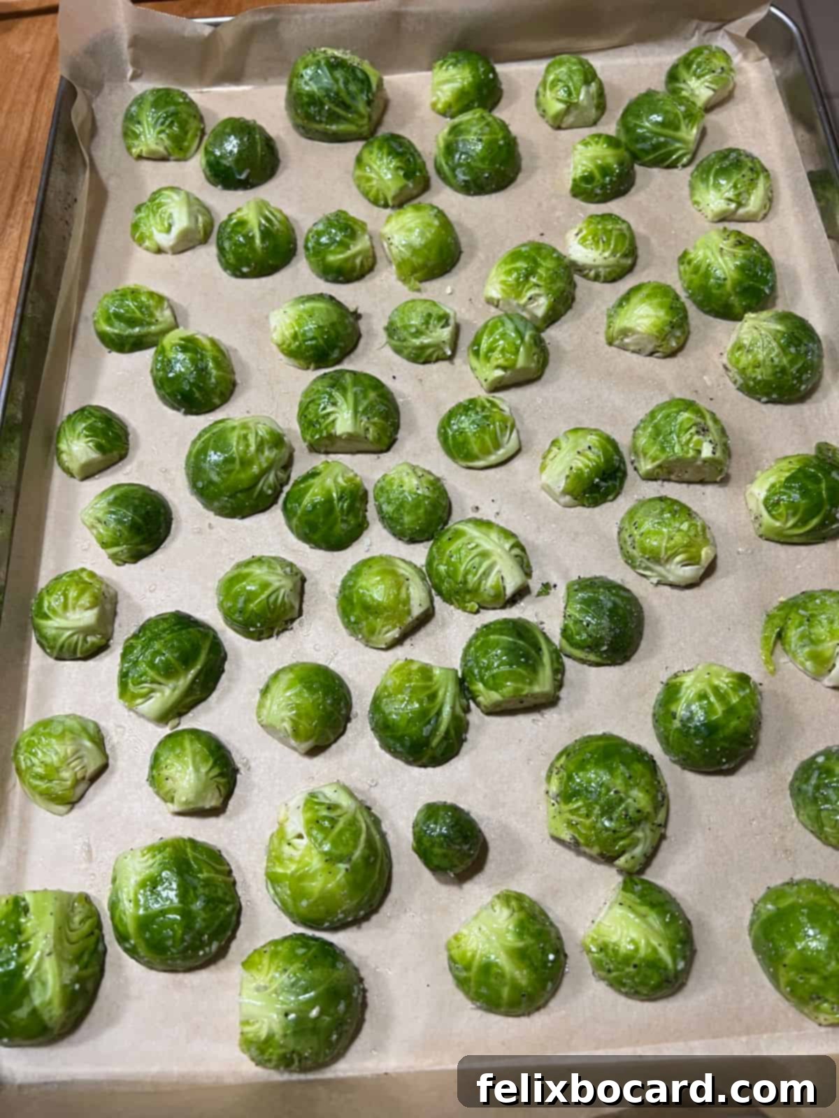 Roasted Brussels Sprouts with Tangy Goat Cheese and Balsamic Glaze 6 Raw sprouts on the baking sheet ready to cook.