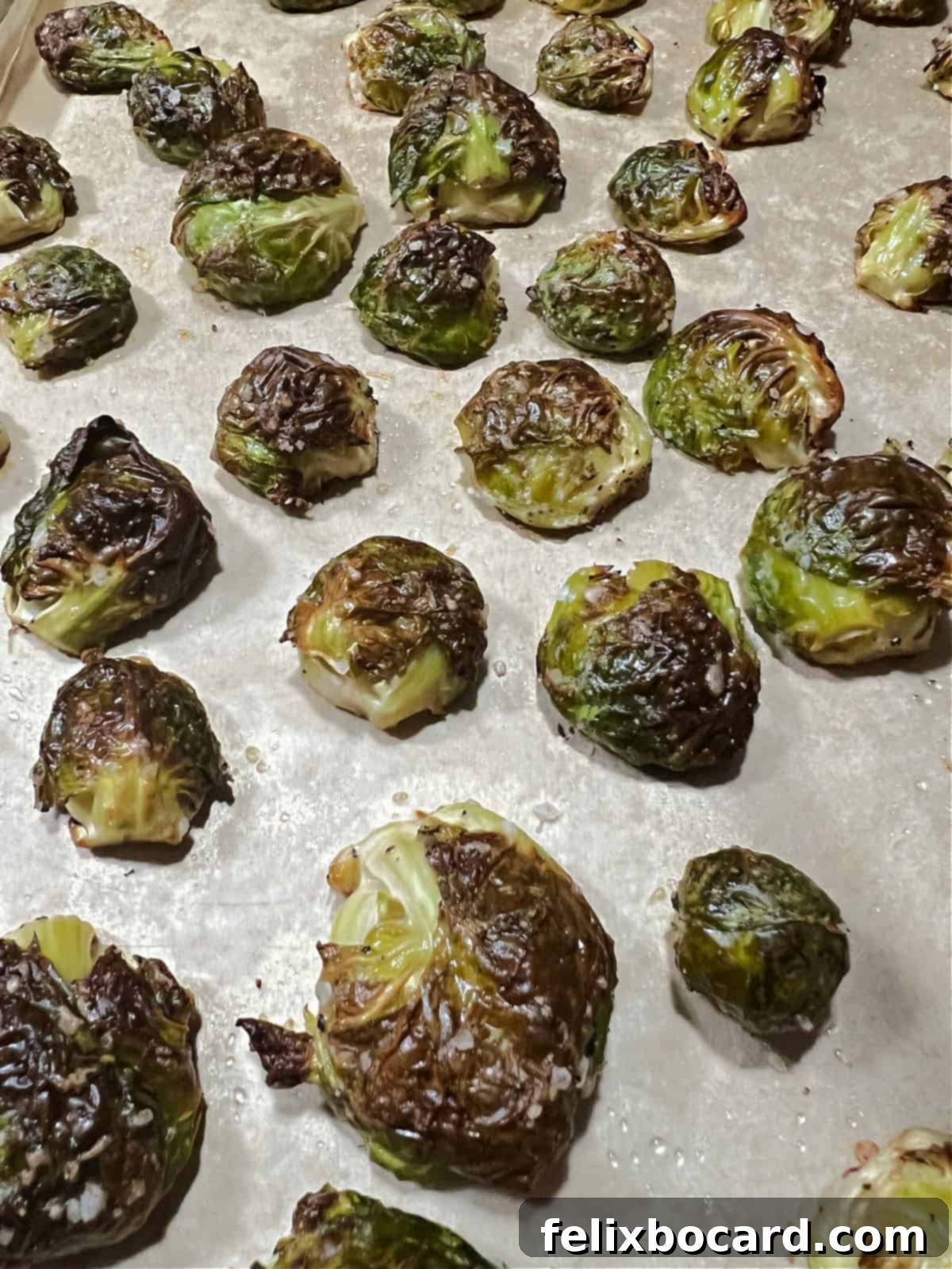 Roasted Brussels Sprouts with Tangy Goat Cheese and Balsamic Glaze 7 Roasted Brussels sprouts on the baking sheet.