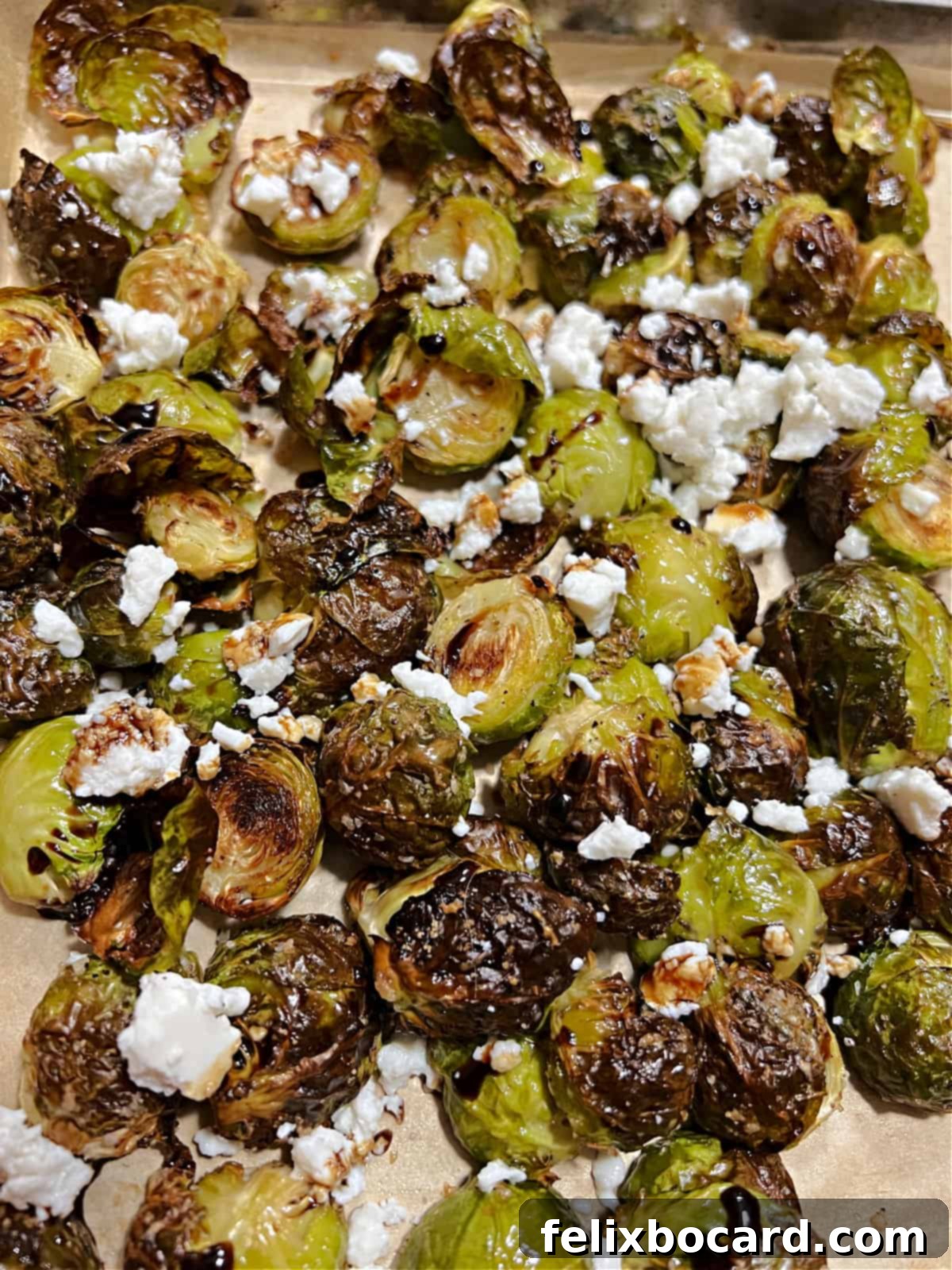 Roasted Brussels Sprouts with Tangy Goat Cheese and Balsamic Glaze 8 Roasted Brussels sprouts with goat cheese and a drizzle of balsamic vinegar.