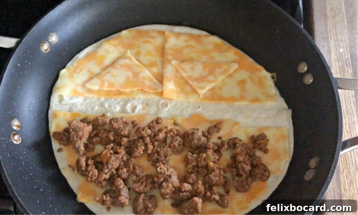 Meat added to half the tortilla.