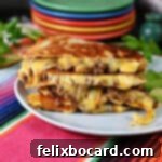 Stack of slices of quesadilla showing the melted cheese and ground beef oozing out.