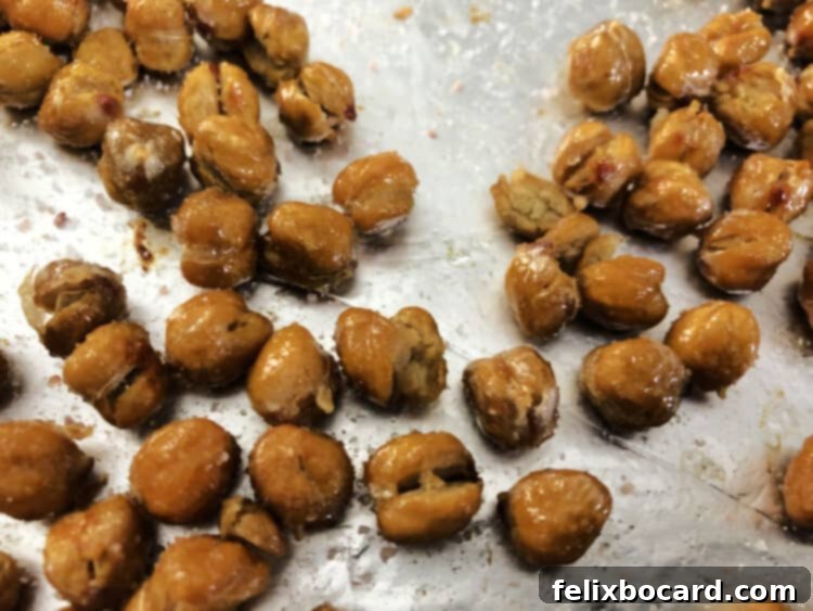 Final roasted chickpeas on foil with salt visible