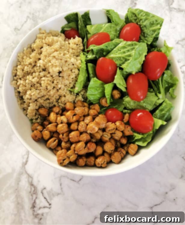 roasted chickpeas in a bowl with quinoa and salad