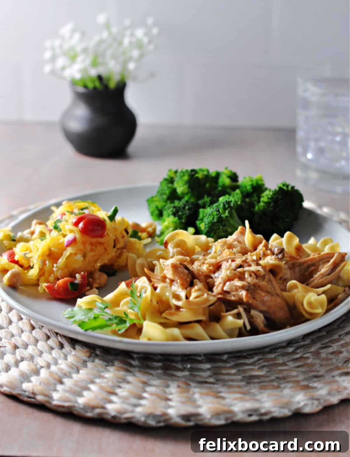 french onion chicken on a plate with broccoli and squash salad
