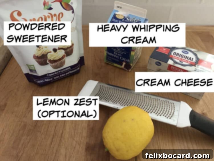Ingredients for Keto Cheesecake Fluff: powdered sweetener, whipping cream, cream cheese, and optional lemon zest displayed on a rustic wooden board.