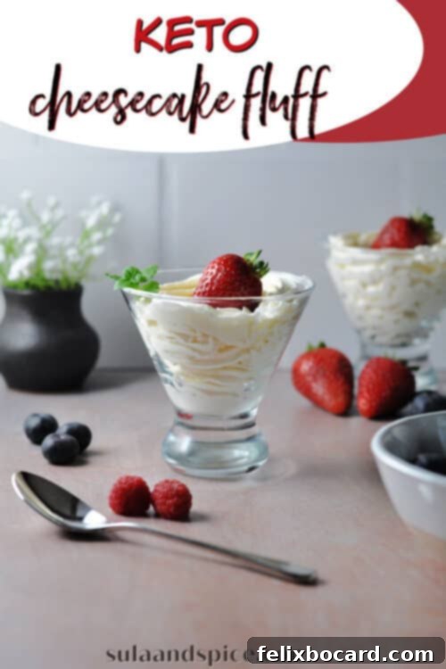 Pin graphic for Keto Cheesecake Fluff, featuring the dessert in a glass with a strawberry garnish.